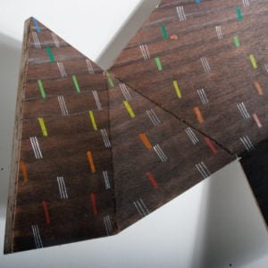plywood wall hanging sculpture related to my rammed earth sculptures