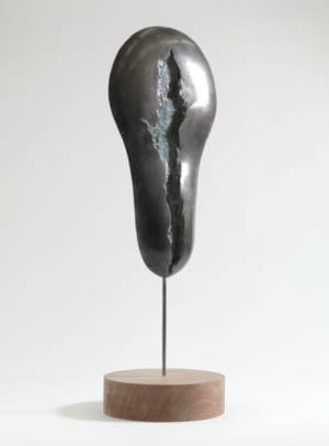 Primitive Streak bronze sculpture by Briony Marshall, 42cm tall abstract form representing the first line of symmetry in human embryonic development, standing on base